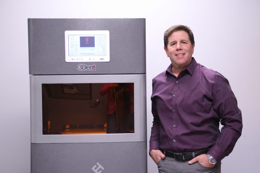 Don Albensi, CEO at Albensi Laboratories in Pittsburgh, uses EnvisionTEC 3D printers for dental models, bridges, 3D printed surgical guides and more. Here, Al;bensi stands next to one of his EnvisionTEC 3Dent 3D printers.