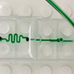 The microfluidic LEGO bricks are designed on AutoCAD and then 3D printed on a Perfactory 3 Mini 3D printer by EnvisionTEC that uses the DLP method of vat polymerisation to cure the material. This technology ensures smooth, accurate fluid channels.