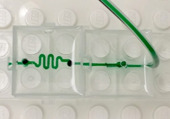 The microfluidic LEGO bricks are designed on AutoCAD and then 3D printed on a Perfactory 3 Mini 3D printer by EnvisionTEC that uses the DLP method of vat polymerisation to cure the material. This technology ensures smooth, accurate fluid channels.